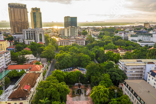 Aerial skyline view of Hanoi city, Vietnam. Hanoi cityscape by sunset period at August Revolution Square, with Hanoi Opera House