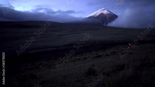 Active life concept. Mountain climber in Cotopaxi Tourist man hiker on landscape of the mountain.