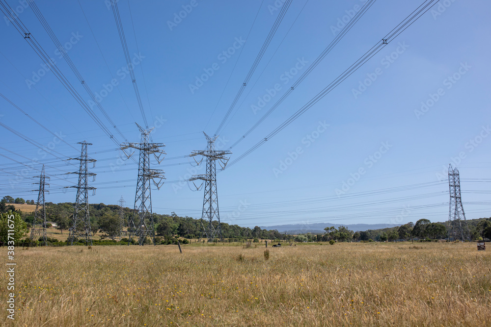 Powerlines in a field in Melbourne, Australia Powerlines in a field in Melbourne, Australia