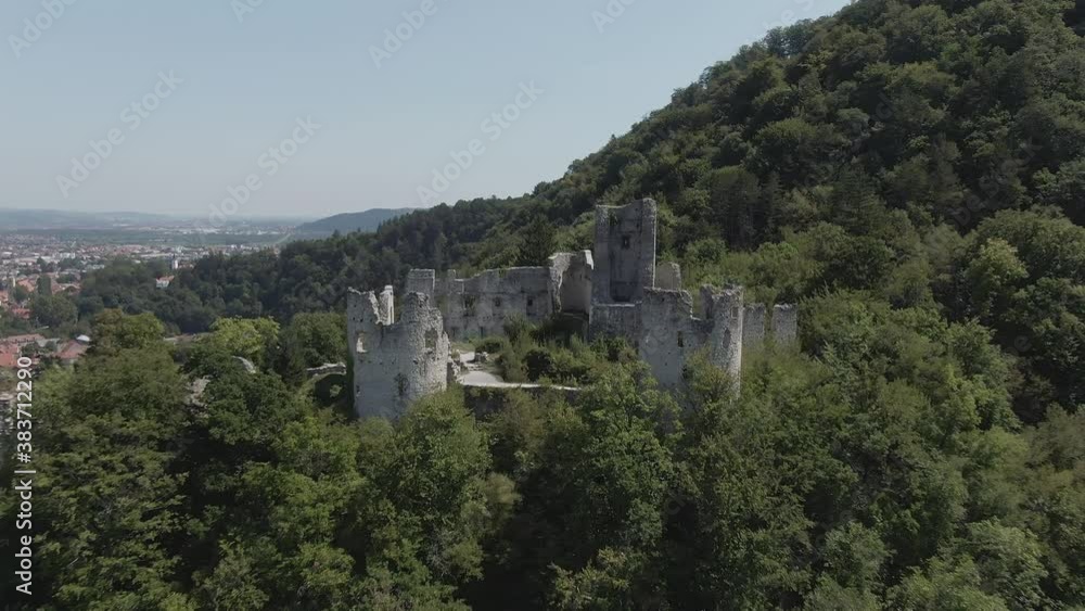 Aerial push in shot at historical old castle of Samobor surrounded by green trees and mountains with blue sky in background. Croatia Aerial push in shot at historical old castle of Samobor surrounded by green trees and mountains with blue sky in background. Croatia