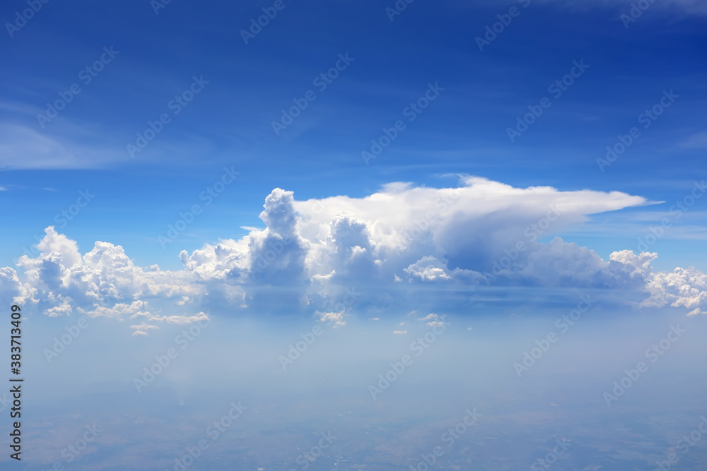 Cloudy blue sky view from airplane window Cloudy blue sky view from airplane window