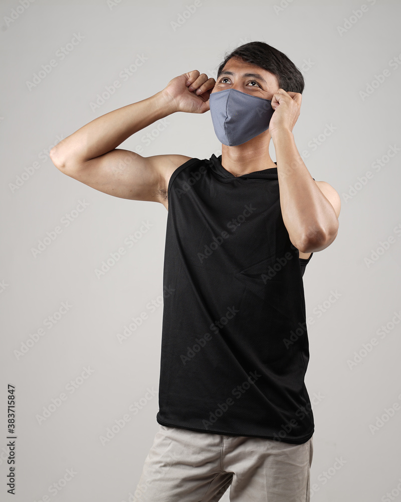 Young men in empty T-shirts and wearing health masks, dress up and pose like famous T-shirt models. Men's t-shirt template and mockup design for print. Young men in empty T-shirts and wearing health masks, dress up and pose like famous T-shirt models. Men's t-shirt template and mockup design for print.
