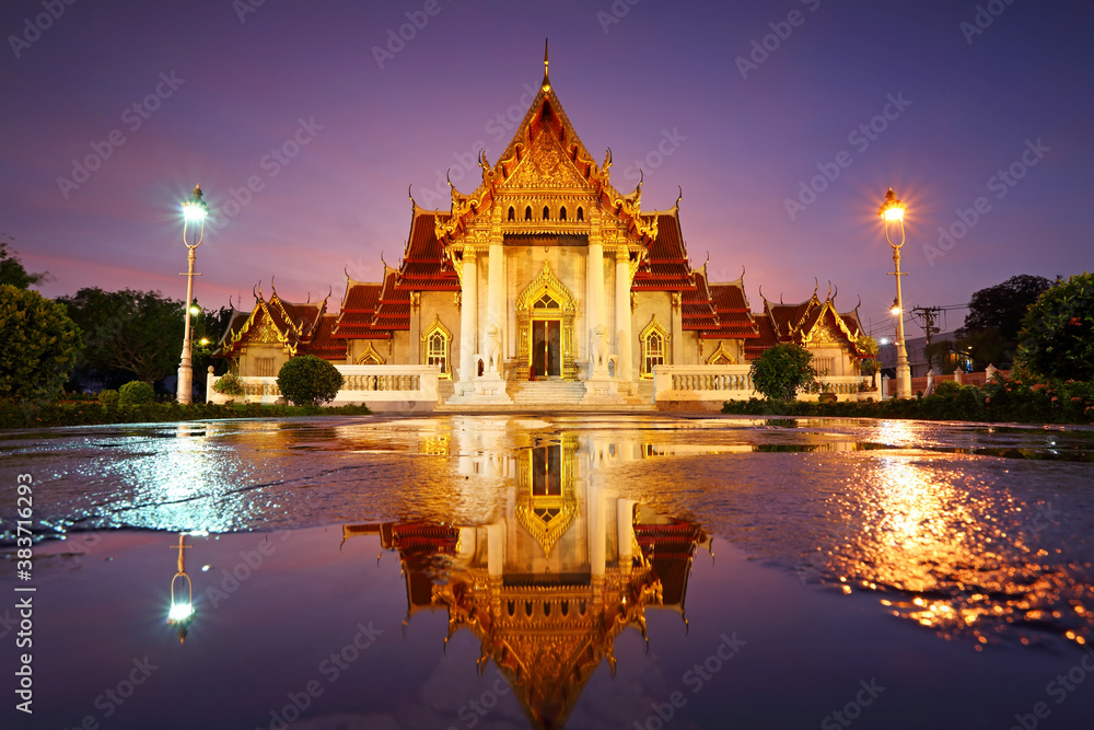 Beautiful water reflection of Wat Benjamaborphit or Marble Temple at twilight in Bangkok, Thailand