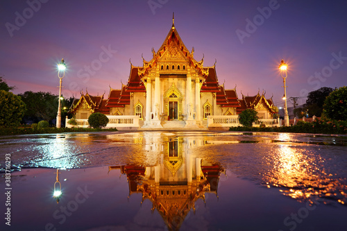 Beautiful water reflection of Wat Benjamaborphit or Marble Temple at twilight in Bangkok, Thailand