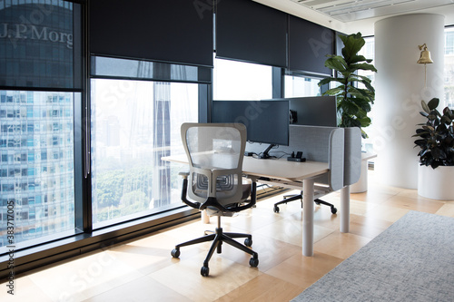 Office with a view of the cityscape from the near by window with plenty of natural light modern office fitout photo