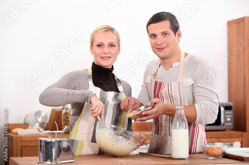 Couple baking in kitchen