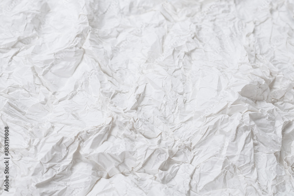 Obraz premium Crumpled white paper background.