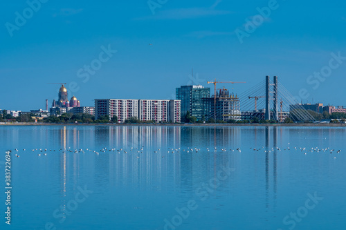 A Beautiful Cityscape Reflected into the Lake at the Cold Blue Sunset