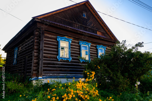 Old wooden log house in a russian village © olyasolodenko