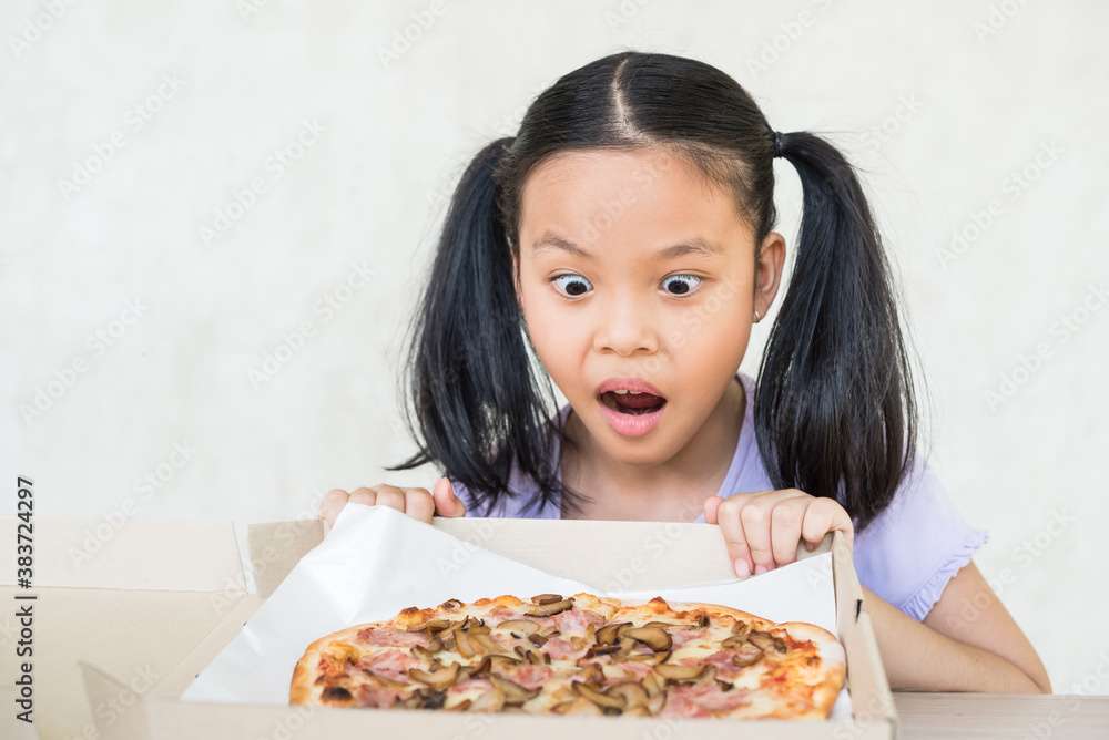 cute little girl holds piece of pizza, hungry student opens mouth wide while sees delicious slice of pizza, wants to eat, positive woman with junk food, people and eating, people and snack concept.