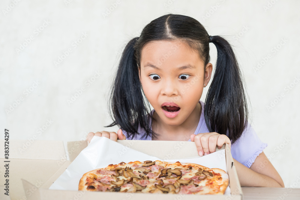 cute little girl holds piece of pizza, hungry student opens mouth wide while sees delicious slice of pizza, wants to eat, positive woman with junk food, people and eating, people and snack concept. cute little girl holds piece of pizza, hungry student opens mouth wide while sees delicious slice of pizza, wants to eat, positive woman with junk food, people and eating, people and snack concept.