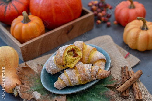 Sweet home made pumpkin crescent rolls on a table