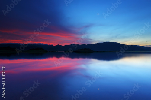 Sunrise over in water reservoir, Eastern Thailand