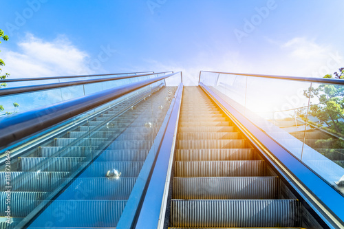 The escalator in the outdoor, urban abstract landscape.