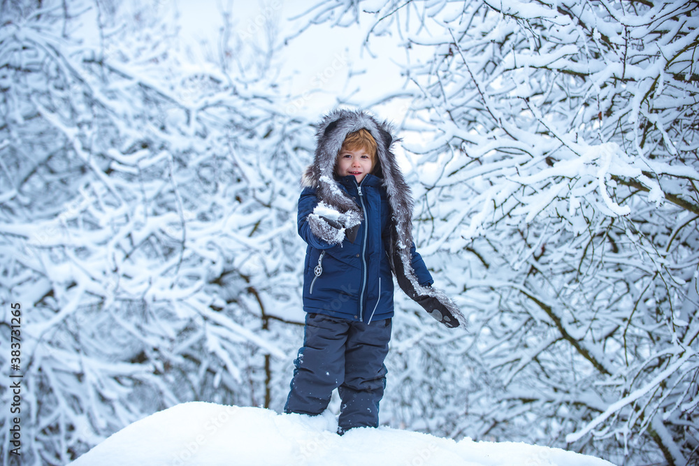 Winter kids leisure. Children run on snowy field. Happy children on nature walks in the winter. Enjoying nature wintertime. Winter kids leisure. Children run on snowy field. Happy children on nature walks in the winter. Enjoying nature wintertime.