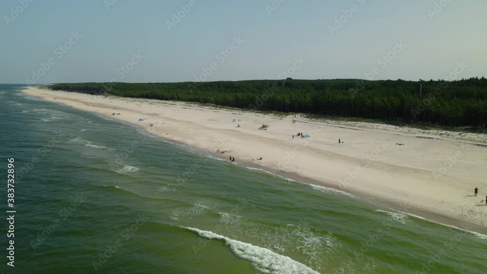 The Beautiful White Sand Beach in Osetnik, Poland - Perfect for Summer Vacation - Aerial Shot The Beautiful White Sand Beach in Osetnik, Poland - Perfect for Summer Vacation - Aerial Shot