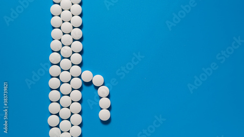 Slika na platnu Male penis from a tablets on a blue background