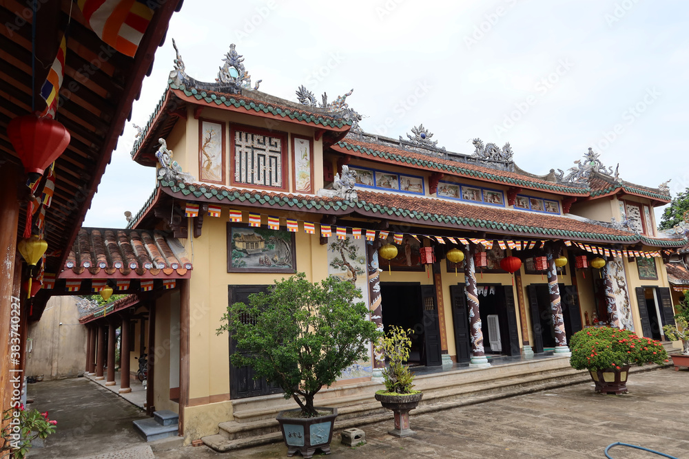 Hoi An, Vietnam, February 21, 2020: Main facade of the colorful Chùa Phước Lâm temple. Hoi An, Vietnam