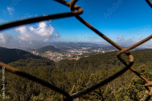 city view of ooty with south indian mountain range doddabetta and dramatic blue sky photo