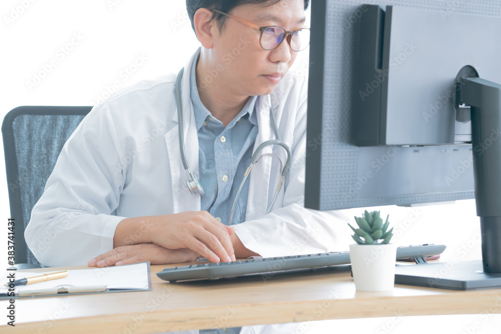 Medical person typing. Close-up of a medical worker typing on computer