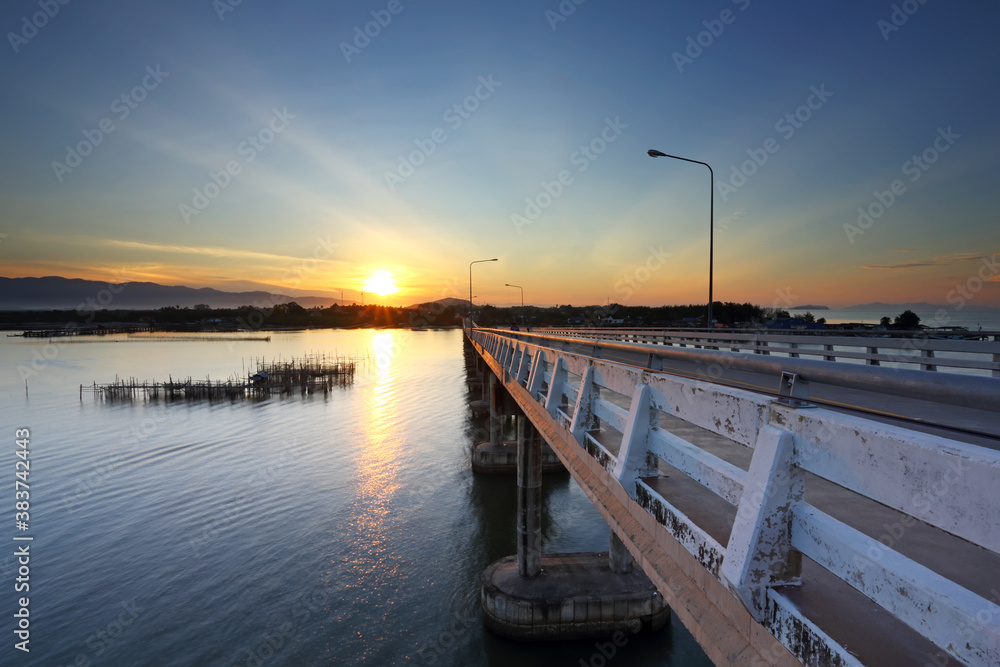 Road bridge on the sea at sunrise, Thailand