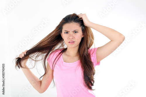 beautiful young south east Asian Chinese woman messy bad hair angry upset