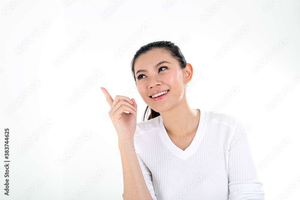 beautiful young south east Asian Chinese woman pointing finger up on white background beautiful young south east Asian Chinese woman pointing finger up on white background
