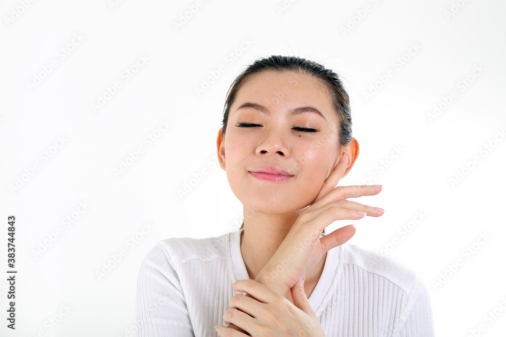 beautiful young south east Asian Chinese woman hand on cheek chin eye closed on white background beautiful young south east Asian Chinese woman hand on cheek chin eye closed on white background