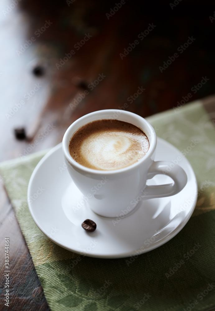 Cup of coffee on rustic wooden background. Close up. Cup of coffee on rustic wooden background. Close up.