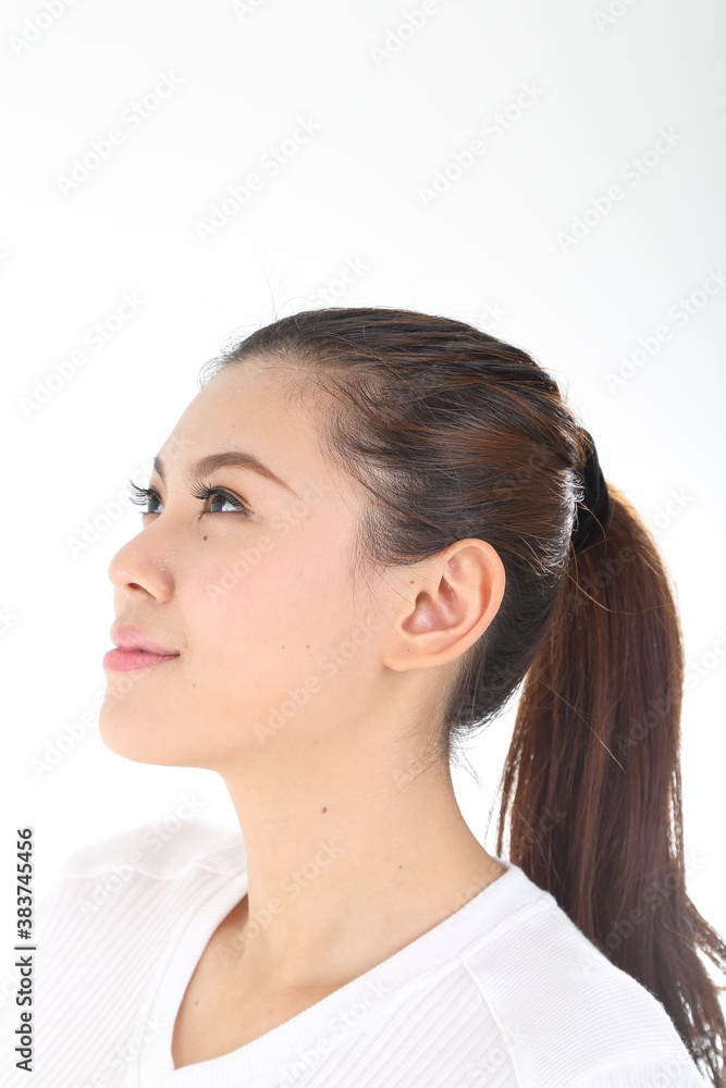 beautiful young south east Asian Chinese woman relax look up on white background beautiful young south east Asian Chinese woman relax look up on white background