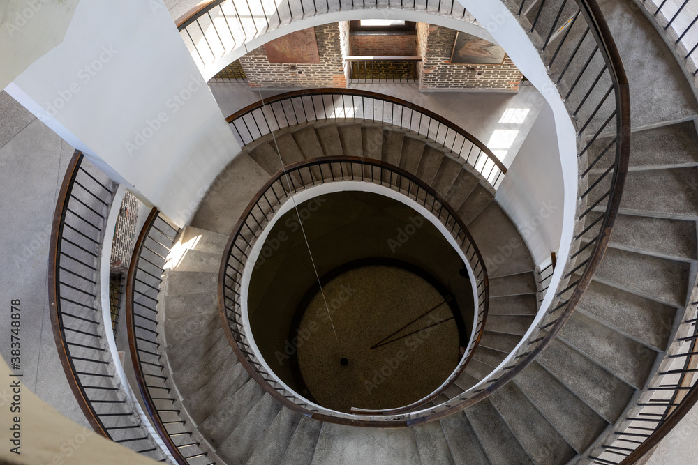 Fototapeta premium Stairs and Foucault's Pendulum suspended within the belfry or Radziejowski Tower on Cathedral Hill, Frombork. Poland