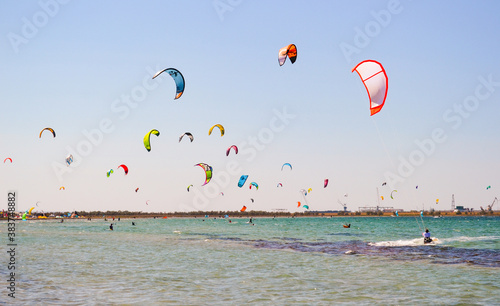 
Kitesurfing. Lots of parachutes over the sea