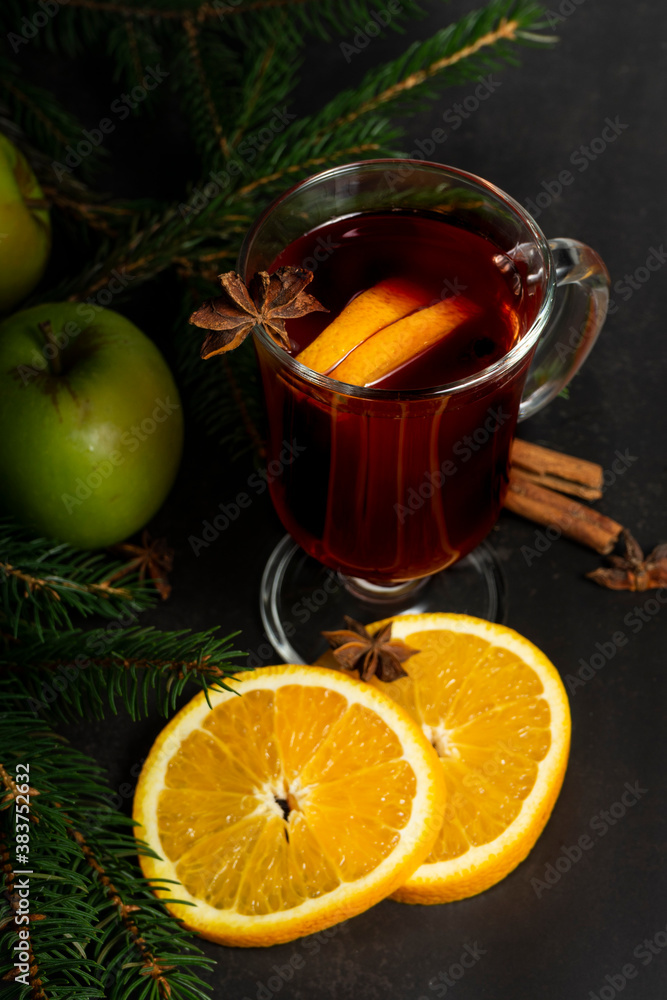 selective focus, hot drink, warmed red wine with fruit from oranges and apples, with spices of anise and cinnamon selective focus, hot drink, warmed red wine with fruit from oranges and apples, with spices of anise and cinnamon