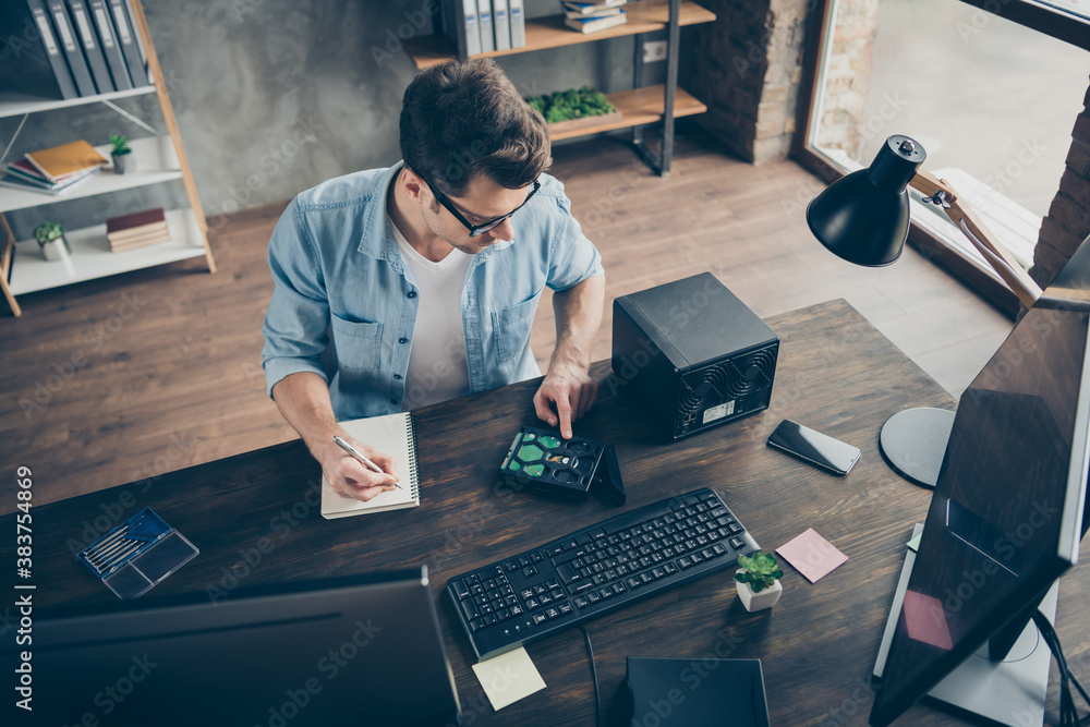 Top above high angle view portrait of his he nice attractive experienced guy repairing software hardware drive cpu programming invention at modern loft brick interior style work place station indoors