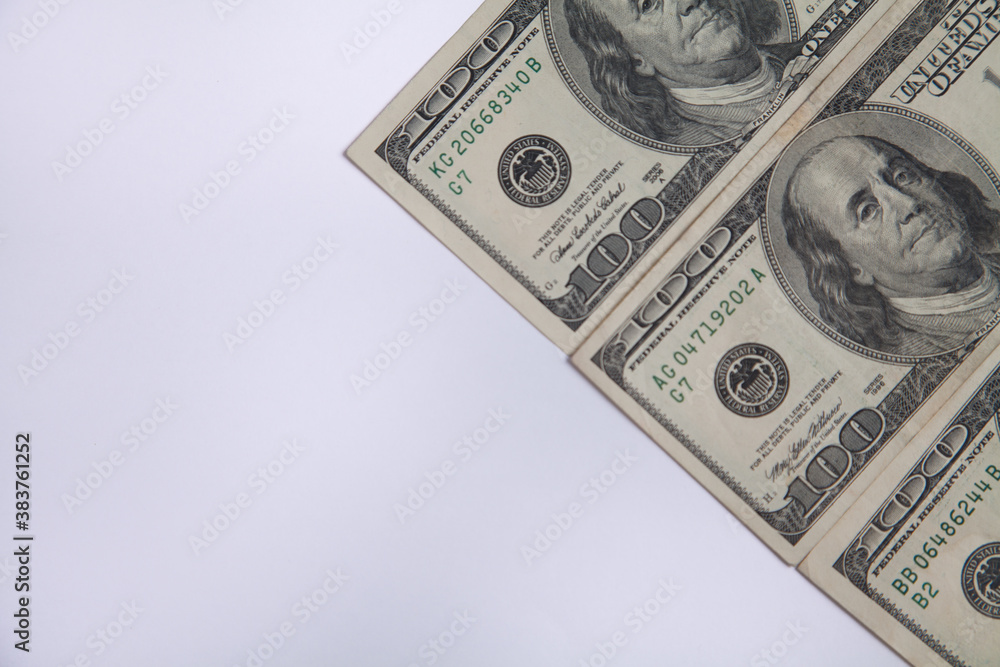 A pile of one hundred US banknotes. Dollar background image. A pile of one hundred US banknotes. Dollar background image.