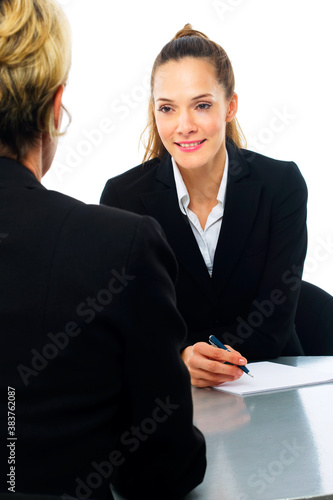 two women during a business meeting on white background studio