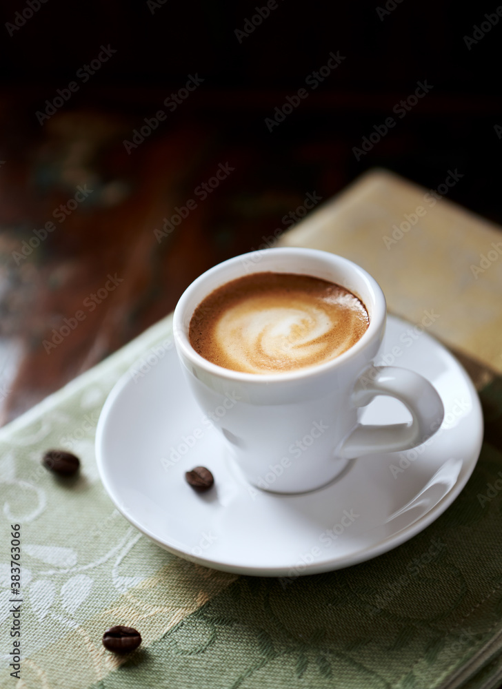 Cup of coffee on rustic wooden background. Close up. Cup of coffee on rustic wooden background. Close up.
