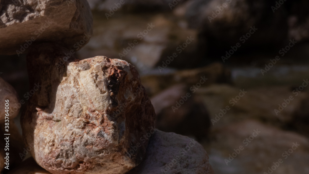 Stone with river in background
