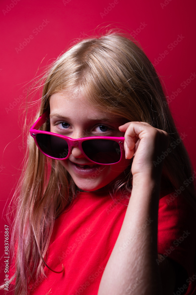Portrait of a young girl on red background Portrait of a young girl on red background