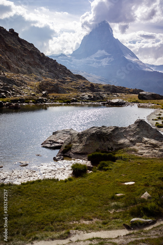 Small lake on a summer day with the Matterhorn in the distance. 