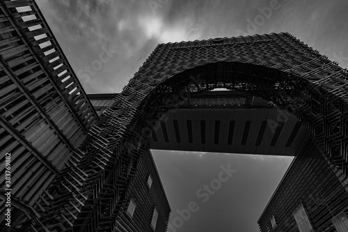 Obraz na plátně a black and white photo of a big metal archways