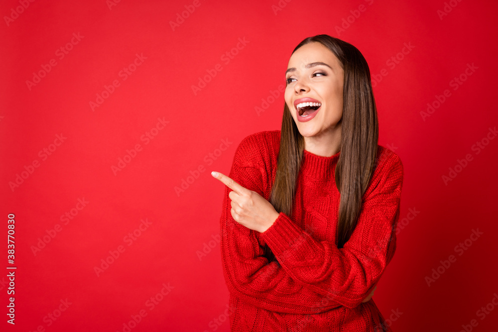Photo of cheerful girl point index finger empty space for ads promo laugh wear jumper isolated over red shine color background - obrazy, fototapety, plakaty 