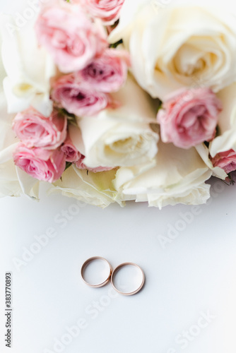 bridal bouquet with wedding rings, pink roses, bridal bouquet of roses