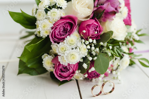 bouquet of pink roses, bridal bouquet of roses, bridal bouquet with wedding rings, wedding rings