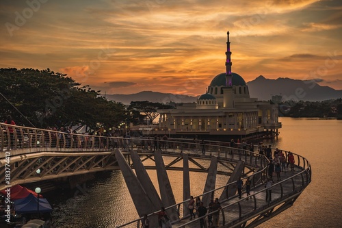 Photography The floating mosque of Kuching and The Darul Hana Bridge during sunset