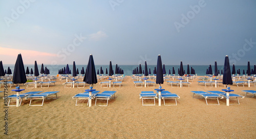 A holiday in Italy is beautiful living the days on the beach away from the sun with colorful umbrellas. © aliberti
