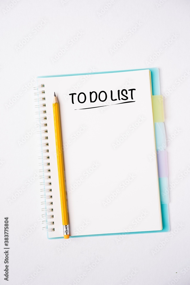 TO DO LIST wordings on a notebook on a table TO DO LIST wordings on a notebook on a table