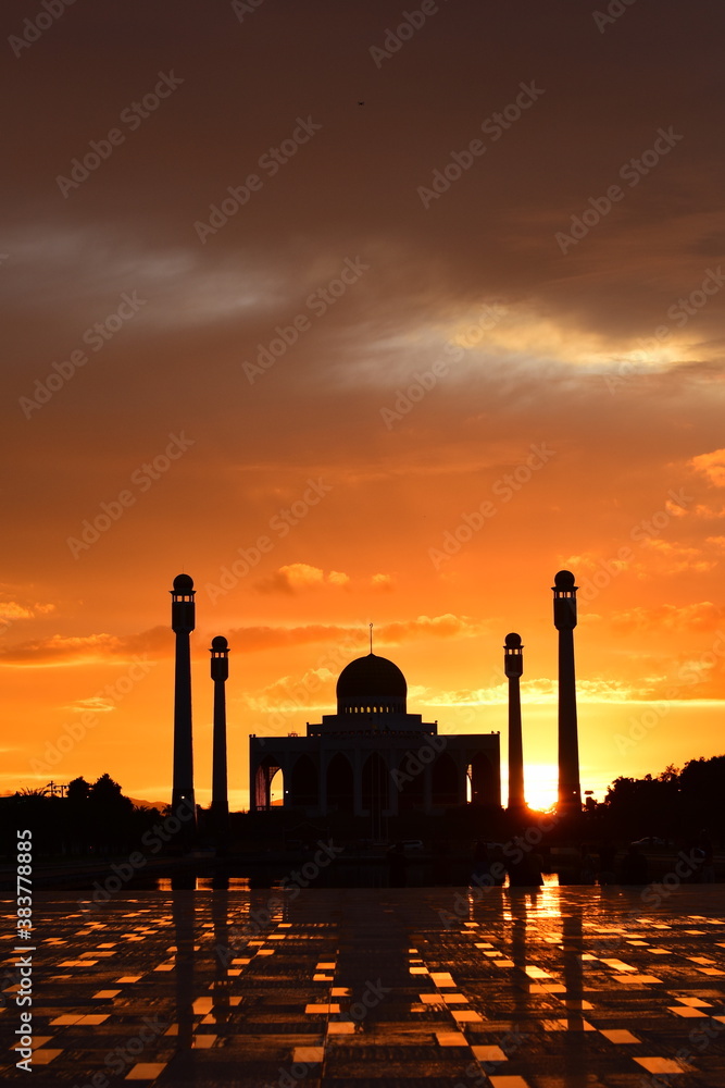 Sunset view with beautiful golden sky At Masjid in the middle of Songkhla Province, the colorful sky lights in the evening