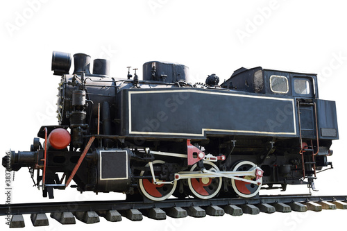 An old steam locomotive without carriages stands on the rails on a clean white background with clipping. Photographed from the side
