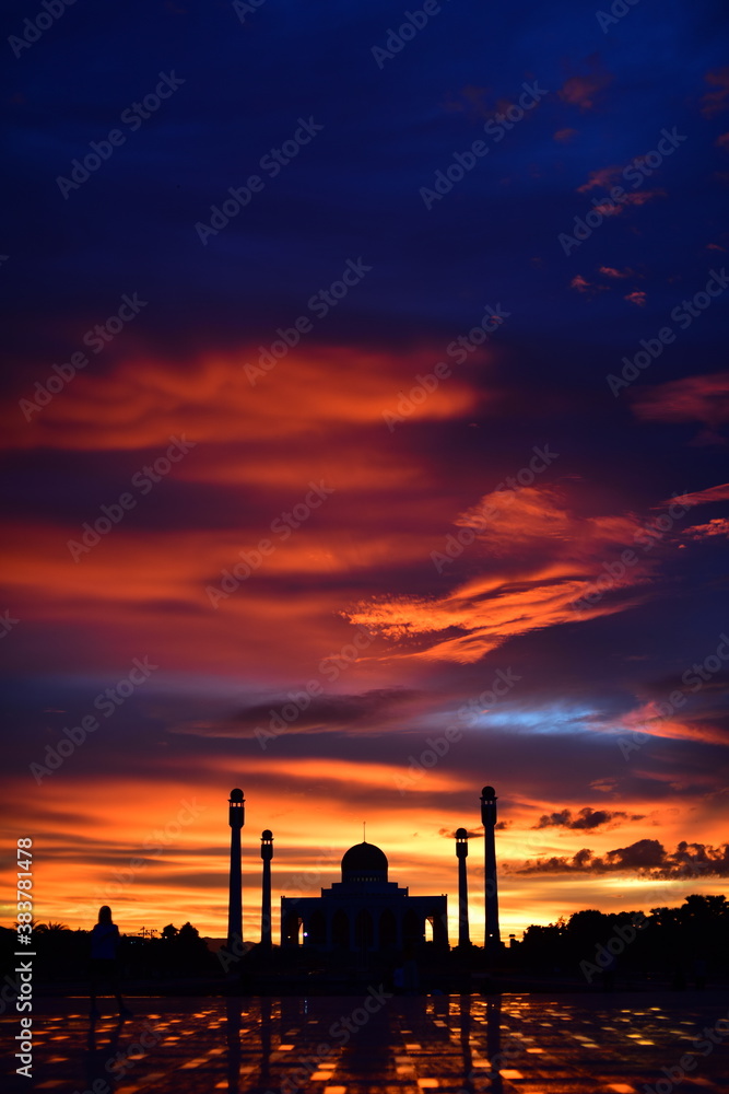 Sunset view with beautiful golden sky At Masjid in the middle of Songkhla Province, the colorful sky lights in the evening	